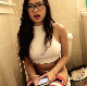 An attractive Asian-American girl wearing glasses records herself farting repeatedly while sitting on a toilet. No pooping. Presented in 720P HD. About 2.5 minutes.